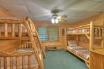 Lower level bedroom offers two sets of bunk beds 1- Full and 3 Twins 